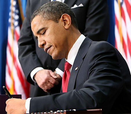Media Name: obama-signs.jpg